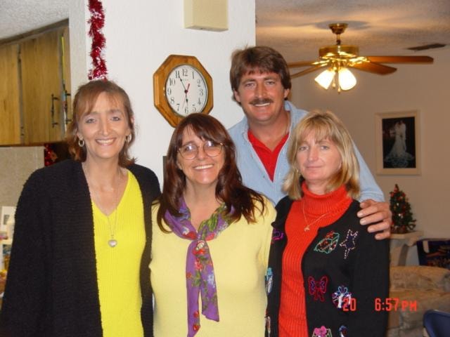 Group of four people at Christmas gathering