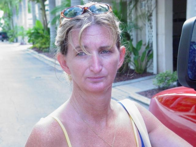 Woman with sunglasses outdoors tropical setting