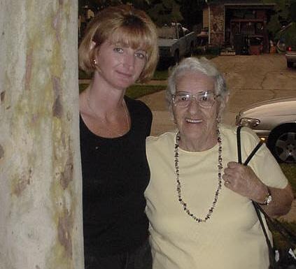 Woman with elderly woman outdoors