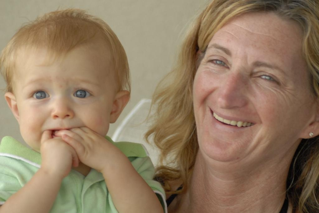 Woman smiling with baby blue eyes