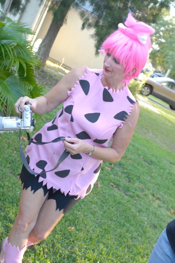 Woman in Pebbles Flintstones costume outdoors