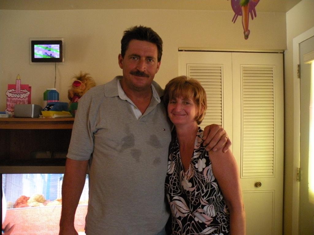 Man and woman posing together indoors