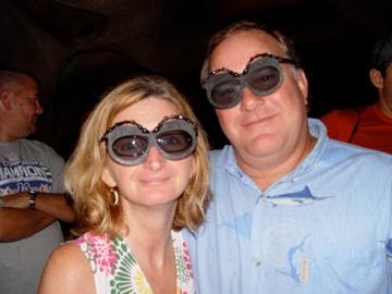 Couple wearing novelty glasses at event