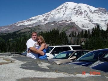 Couple hugging at Mount Rainier parking area