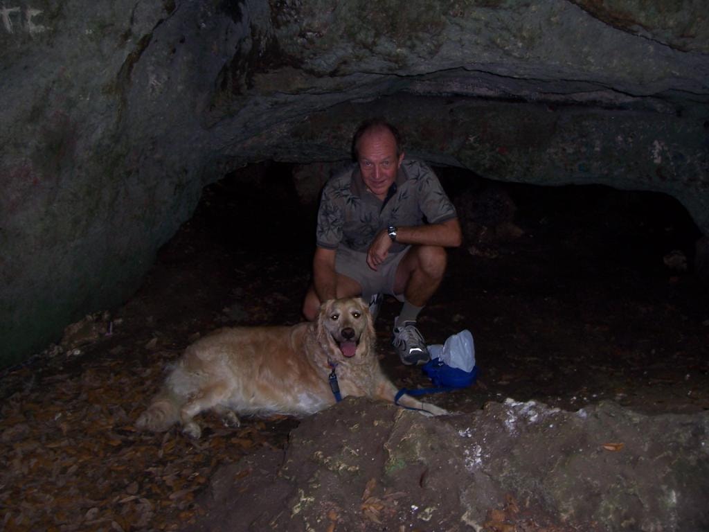 David Zettel with dog in cave