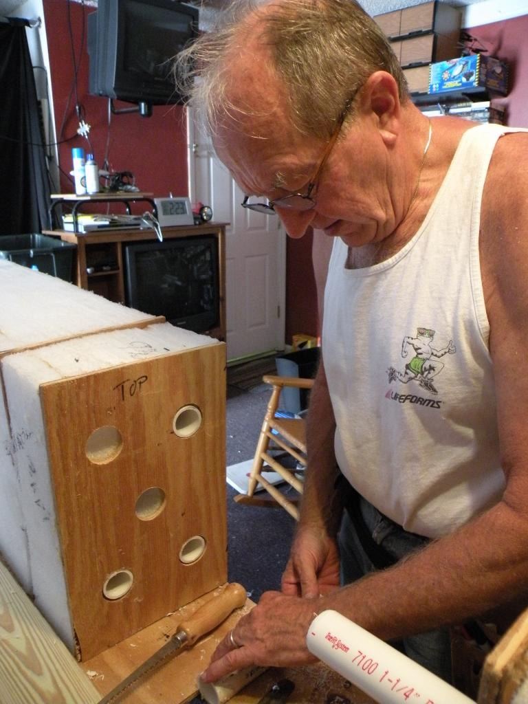 David Zettel working on a wooden project in his workshop